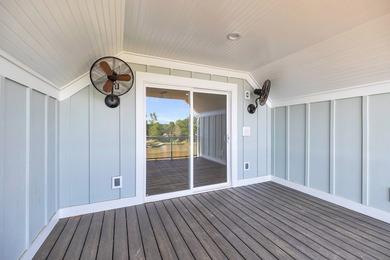 Discover the epitome of lakeside living at 301 Portland Circle on The Links At Stoney Point in South Carolina - for sale on GolfHomes.com, golf home, golf lot