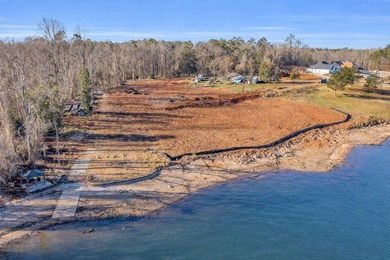 Discover the epitome of lakeside living at 301 Portland Circle on The Links At Stoney Point in South Carolina - for sale on GolfHomes.com, golf home, golf lot