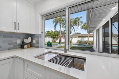 Nestled in the desirable Tanglewood neighborhood, this on Mangrove Bay Golf Course in Florida - for sale on GolfHomes.com, golf home, golf lot