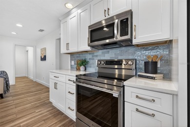 Nestled in the desirable Tanglewood neighborhood, this on Mangrove Bay Golf Course in Florida - for sale on GolfHomes.com, golf home, golf lot