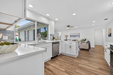 Nestled in the desirable Tanglewood neighborhood, this on Mangrove Bay Golf Course in Florida - for sale on GolfHomes.com, golf home, golf lot