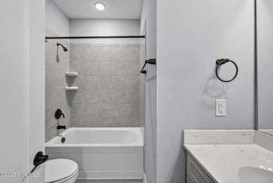 This beautifully maintained residence is set within the popular on Magnolia Greens Golf Plantation in North Carolina - for sale on GolfHomes.com, golf home, golf lot