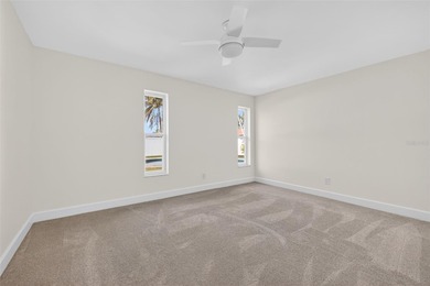 Nestled in the desirable Tanglewood neighborhood, this on Mangrove Bay Golf Course in Florida - for sale on GolfHomes.com, golf home, golf lot