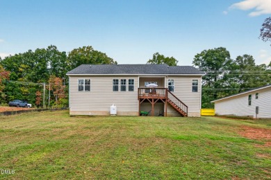 This better than new custom built 2021 home offers an open floor on River Golf and Country Club at Lake Royale in North Carolina - for sale on GolfHomes.com, golf home, golf lot