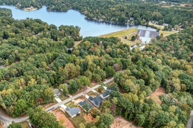 This better than new custom built 2021 home offers an open floor on River Golf and Country Club at Lake Royale in North Carolina - for sale on GolfHomes.com, golf home, golf lot