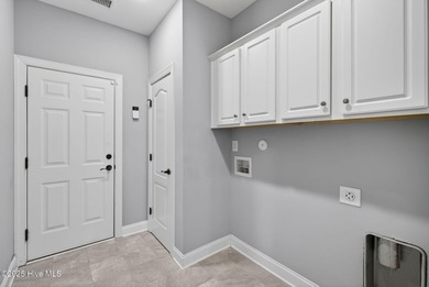 This beautifully maintained residence is set within the popular on Magnolia Greens Golf Plantation in North Carolina - for sale on GolfHomes.com, golf home, golf lot