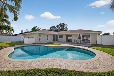 Nestled in the desirable Tanglewood neighborhood, this on Mangrove Bay Golf Course in Florida - for sale on GolfHomes.com, golf home, golf lot