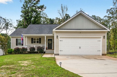 This better than new custom built 2021 home offers an open floor on River Golf and Country Club at Lake Royale in North Carolina - for sale on GolfHomes.com, golf home, golf lot
