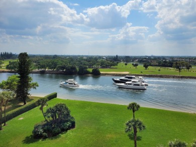 Scenic water, golf, and city views that never get old. Walkable on North Palm Beach Country Club in Florida - for sale on GolfHomes.com, golf home, golf lot