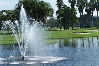 Experience affordable luxury in this beautifully renovated on Wynmoor Golf Course in Florida - for sale on GolfHomes.com, golf home, golf lot