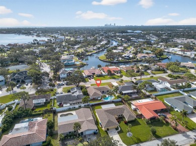 Nestled in the desirable Tanglewood neighborhood, this on Mangrove Bay Golf Course in Florida - for sale on GolfHomes.com, golf home, golf lot