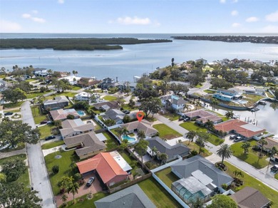 Nestled in the desirable Tanglewood neighborhood, this on Mangrove Bay Golf Course in Florida - for sale on GolfHomes.com, golf home, golf lot