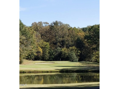 This better than new custom built 2021 home offers an open floor on River Golf and Country Club at Lake Royale in North Carolina - for sale on GolfHomes.com, golf home, golf lot