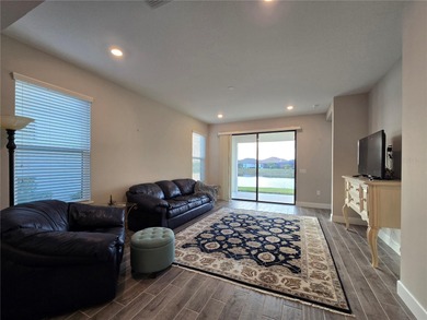 WATERFRONT HOME! Like New MAGARI MODEL HOME, including upgraded on Stonegate Golf Club in Florida - for sale on GolfHomes.com, golf home, golf lot