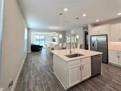 WATERFRONT HOME! Like New MAGARI MODEL HOME, including upgraded on Stonegate Golf Club in Florida - for sale on GolfHomes.com, golf home, golf lot