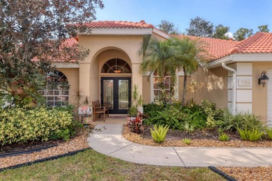 Welcome to this light-filled 3-bedroom, 3-bath home with an on University Park Country Club in Florida - for sale on GolfHomes.com, golf home, golf lot