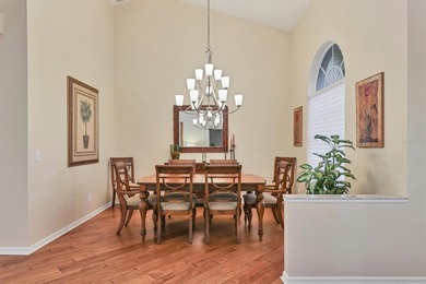 Welcome to this light-filled 3-bedroom, 3-bath home with an on University Park Country Club in Florida - for sale on GolfHomes.com, golf home, golf lot