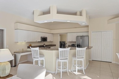 Welcome to this light-filled 3-bedroom, 3-bath home with an on University Park Country Club in Florida - for sale on GolfHomes.com, golf home, golf lot