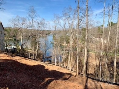 Your Lakefront Legacy Awaits! With its prime peninsula location on Tega Cay Golf Club in South Carolina - for sale on GolfHomes.com, golf home, golf lot