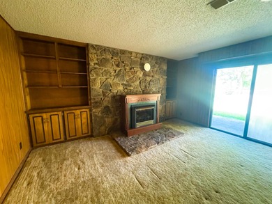 Nestled along the coveted North Golf Course in Cherokee Village on Cherokee Village North Course in Arkansas - for sale on GolfHomes.com, golf home, golf lot