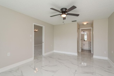 GORGEOUS REMODELED VILLA in TIMBER GREENS a vibrant 55+ golf on Timber Greens Country Club in Florida - for sale on GolfHomes.com, golf home, golf lot