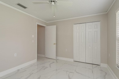 GORGEOUS REMODELED VILLA in TIMBER GREENS a vibrant 55+ golf on Timber Greens Country Club in Florida - for sale on GolfHomes.com, golf home, golf lot