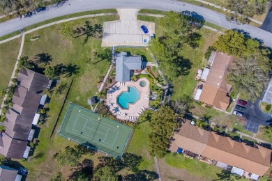 Enjoy the privacy and comfort of a large, split floorplan villa on Highland Lakes Executive Golf Course in Florida - for sale on GolfHomes.com, golf home, golf lot