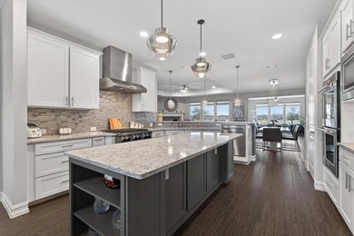 Experience refined living with breathtaking water and sunset on Frisco Lakes Golf Course in Texas - for sale on GolfHomes.com, golf home, golf lot