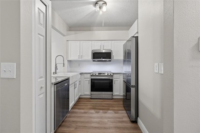 Step into your stunningly updated 2-bedroom, 2.5-bath retreat on Heritage Isles Golf and Country Club in Florida - for sale on GolfHomes.com, golf home, golf lot