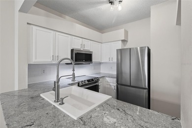 Step into your stunningly updated 2-bedroom, 2.5-bath retreat on Heritage Isles Golf and Country Club in Florida - for sale on GolfHomes.com, golf home, golf lot