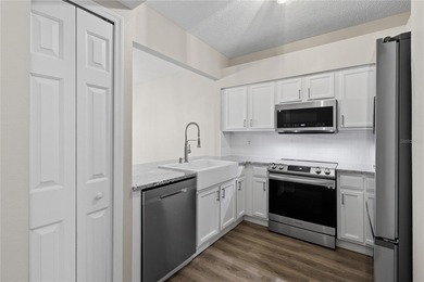 Step into your stunningly updated 2-bedroom, 2.5-bath retreat on Heritage Isles Golf and Country Club in Florida - for sale on GolfHomes.com, golf home, golf lot