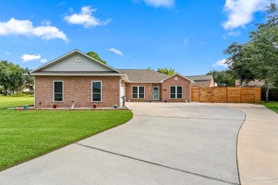 Welcome to this beautifully updated 3-bedroom, 2-bathroom home on Perdido Bay Golf Club in Florida - for sale on GolfHomes.com, golf home, golf lot