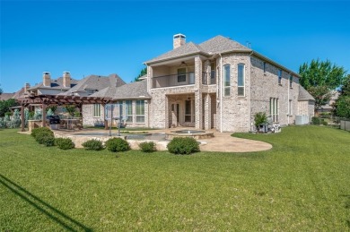 Nestled on a premier GOLF COURSE lot overlooking the tee box of on Lantana Golf Club in Texas - for sale on GolfHomes.com, golf home, golf lot