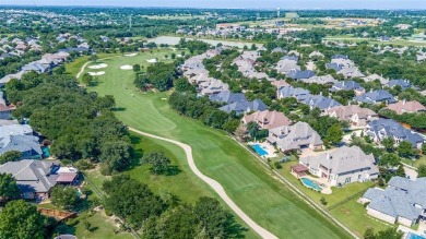 Nestled on a premier GOLF COURSE lot overlooking the tee box of on Lantana Golf Club in Texas - for sale on GolfHomes.com, golf home, golf lot