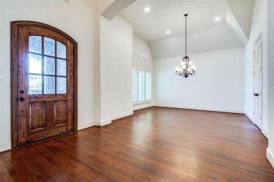Nestled on a premier GOLF COURSE lot overlooking the tee box of on Lantana Golf Club in Texas - for sale on GolfHomes.com, golf home, golf lot