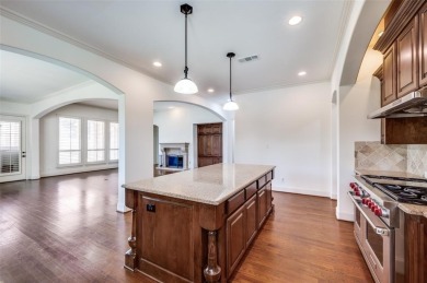 Nestled on a premier GOLF COURSE lot overlooking the tee box of on Lantana Golf Club in Texas - for sale on GolfHomes.com, golf home, golf lot