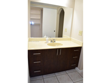 Spacious 2/2 on ground floor with views to the well maintained on Woodmont Country Club in Florida - for sale on GolfHomes.com, golf home, golf lot