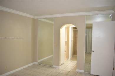 Spacious 2/2 on ground floor with views to the well maintained on Woodmont Country Club in Florida - for sale on GolfHomes.com, golf home, golf lot