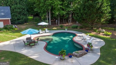 Welcome to this stunning all-brick ranch nestled in a desirable on Monroe Golf and Country Club in Georgia - for sale on GolfHomes.com, golf home, golf lot