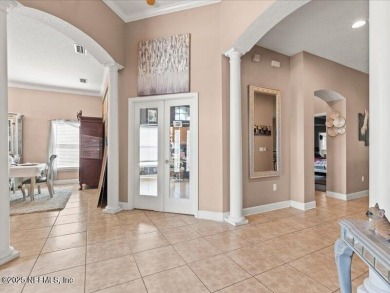 This exquisite 5-bedroom, 5-bathroom home in Fleming Island on Golf Club At Fleming Island in Florida - for sale on GolfHomes.com, golf home, golf lot