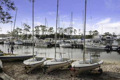 Wake to the stillness of the lake, coffee in hand on your on Golf Club at Bluewater Bay Resort in Florida - for sale on GolfHomes.com, golf home, golf lot