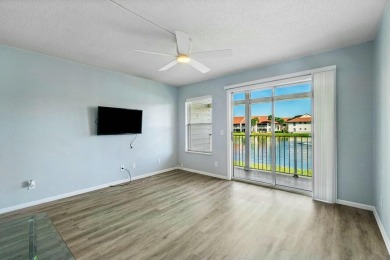 Enjoy breathtaking panoramic lake views from this charming on PGA National Golf Club in Florida - for sale on GolfHomes.com, golf home, golf lot