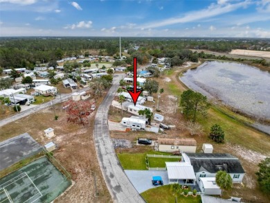 SNOWBIRDS OR HOMEOWNERS WELCOME- YOU OWN the land. 2 Bedroom on Glen Lakes Country Club in Florida - for sale on GolfHomes.com, golf home, golf lot