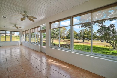 OUTSTANDING GOLF FRONT CUSTOM GRANVILLE IN WINDWARD HILLS WITH on Eagle Ridge At Spruce Creek Country Club in Florida - for sale on GolfHomes.com, golf home, golf lot