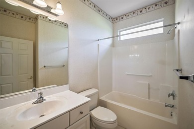 OUTSTANDING GOLF FRONT CUSTOM GRANVILLE IN WINDWARD HILLS WITH on Eagle Ridge At Spruce Creek Country Club in Florida - for sale on GolfHomes.com, golf home, golf lot