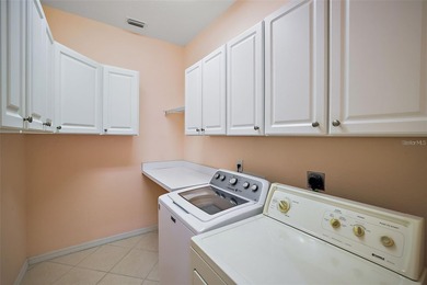 OUTSTANDING GOLF FRONT CUSTOM GRANVILLE IN WINDWARD HILLS WITH on Eagle Ridge At Spruce Creek Country Club in Florida - for sale on GolfHomes.com, golf home, golf lot