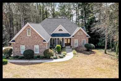 This charming predominately brick home boasts a three-car garage on Keowee Key Golf and Country Club in South Carolina - for sale on GolfHomes.com, golf home, golf lot