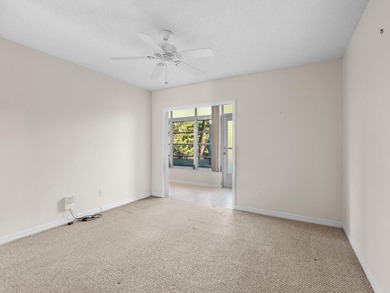 Welcome to this charming 2-bedroom, 2-bath first-floor corner on The American Golf Club in Florida - for sale on GolfHomes.com, golf home, golf lot