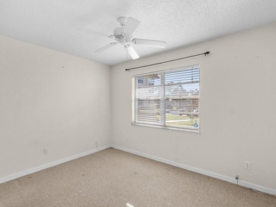 Welcome to this charming 2-bedroom, 2-bath first-floor corner on The American Golf Club in Florida - for sale on GolfHomes.com, golf home, golf lot