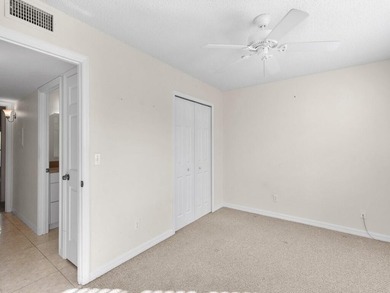 Welcome to this charming 2-bedroom, 2-bath first-floor corner on The American Golf Club in Florida - for sale on GolfHomes.com, golf home, golf lot